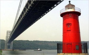 Little Red Lighthouse under big grey bridge